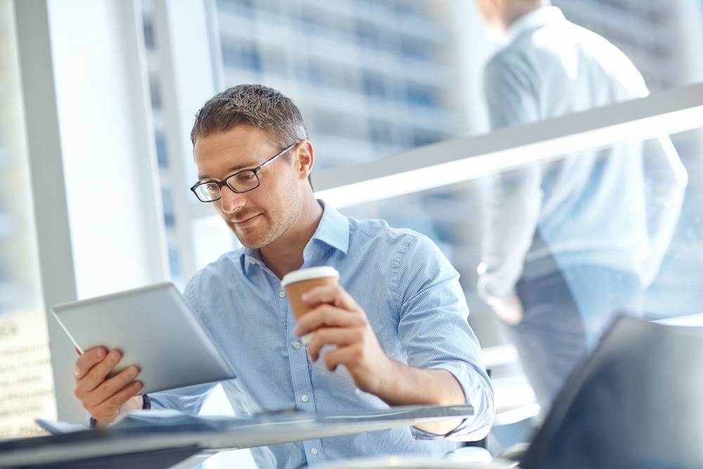 man reading a business blog