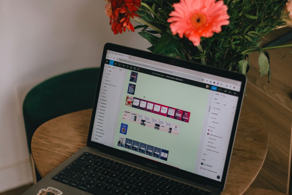 A laptop sitting on top of a wooden table, highlighting the use of digital tools and technology in social media marketing and SEO integration.